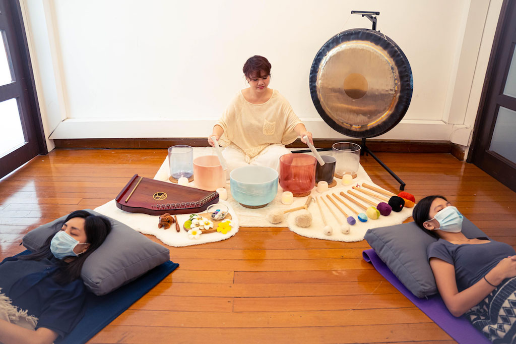 She uses a therapy harp, a gong, alchemy crystal bowls and other complementary sound healing tools, which release vibrations that are said to relax the mind and body.
