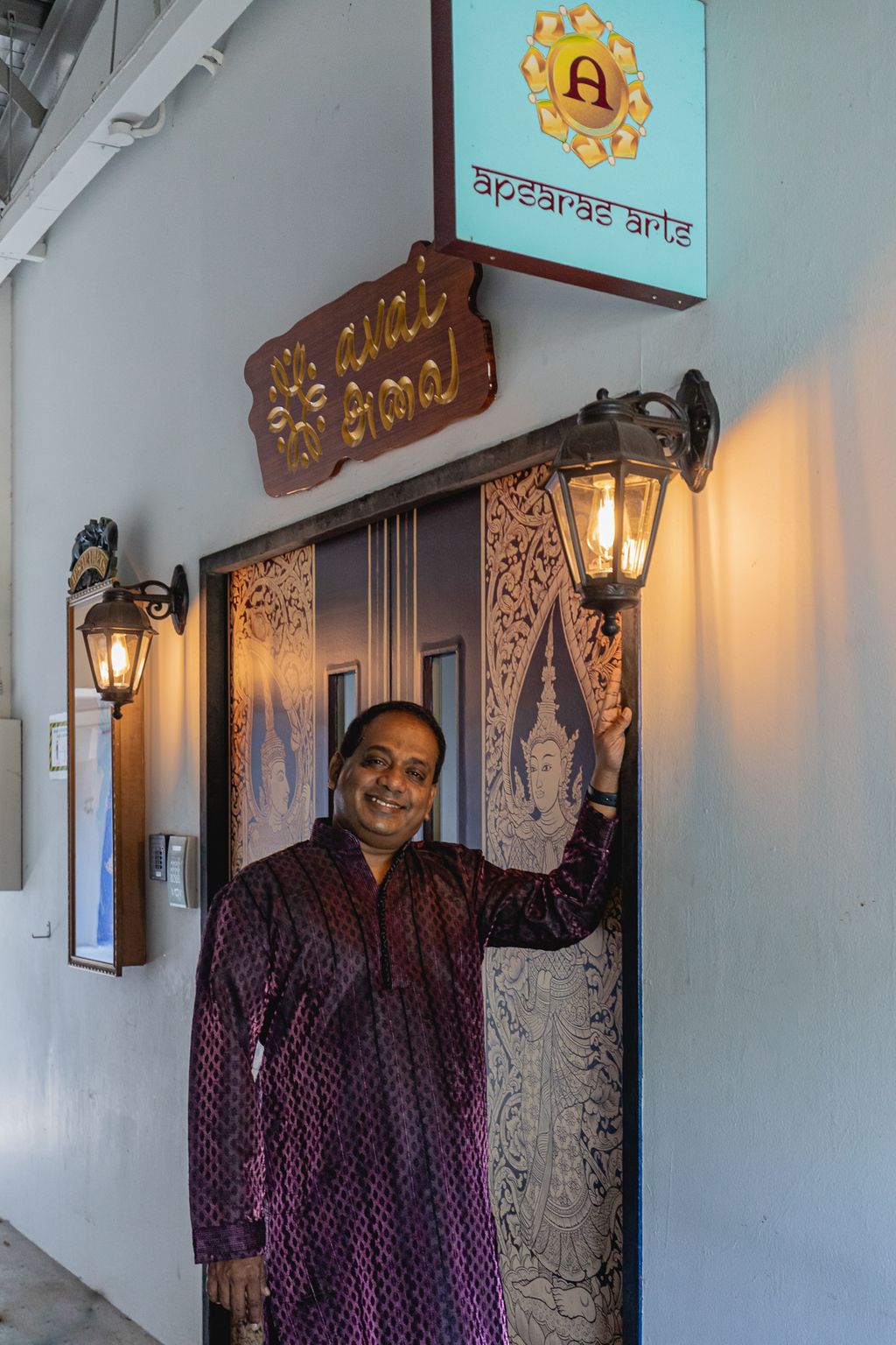Aravinth at the entrance of Apsaras Arts, located at Goodman Arts Centre
