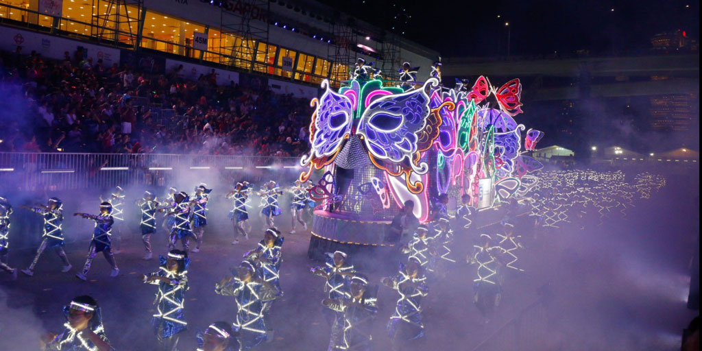 Image caption: A float accompanied by performers in the 2019 Chingay procession