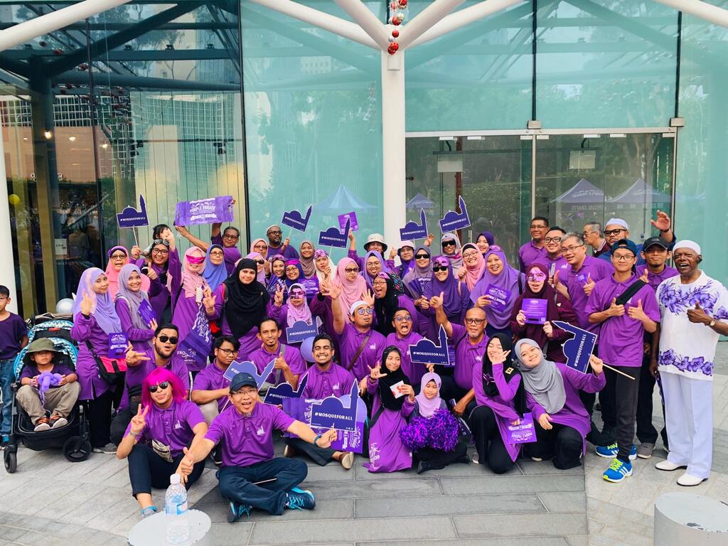  Khidir with members of the deaf Muslim community at the Purple Parade in 2019. The event celebrates the abilities of people with special needs.
