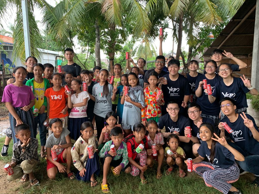 Danish with his fellow volunteers and Cambodian children during his Youth Expedition Project (YEP) trip