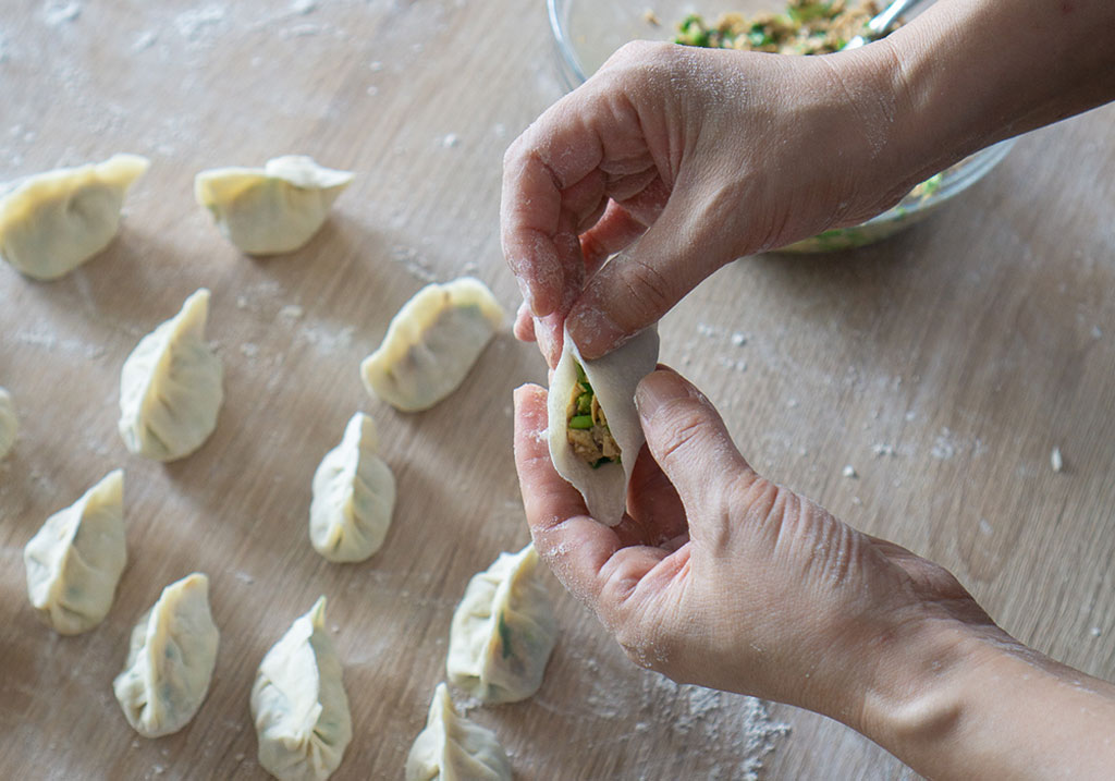 Joy folding vegan dumplings